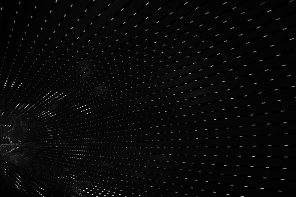 black tunnel interior with white lights