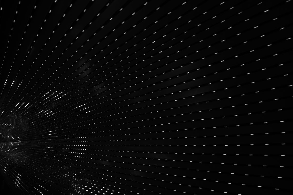 black tunnel interior with white lights